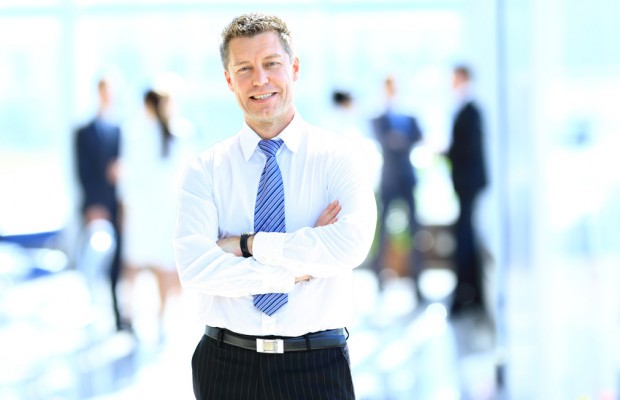 Smiling businessman in his office