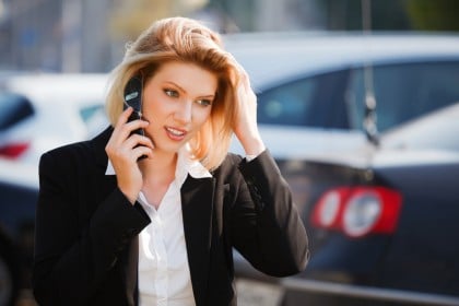 Young businesswoman calling on the mobile phone