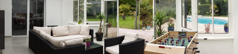 Véranda en alu : dégager espace et lumière, et une future plus-value